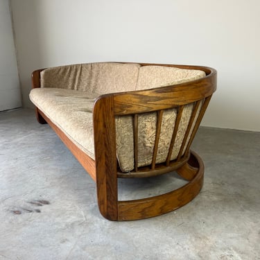 Mid-Century Curved Barrel Shape Spindle Back Solid Oak Sofa by Howard 