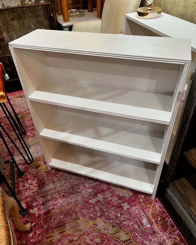 White painted bookcase. 30.25” x 9.5” x 36” 