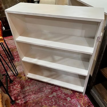 White painted bookcase. 30.25” x 9.5” x 36” 