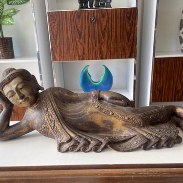 Vintage Serenity: Reclining Buddha Sculpture with Intricate Detailing