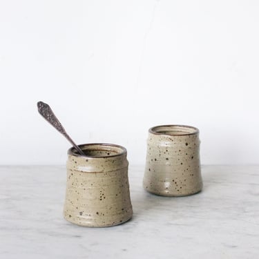 Pair of Stoneware Tumblers with Silver Teaspoons