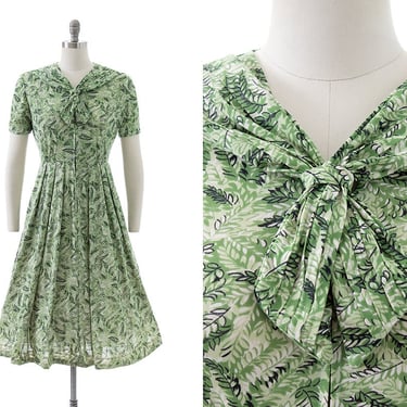 Vintage 1960s Dress | 60s Fern Leaves Green Printed Nylon Jersey Tie Neck Fit and Flare Day Dress (medium) 