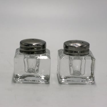 vintage glass salt and pepper shakers with silver metal tops 