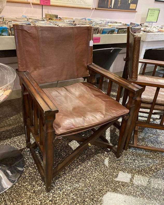 Two leather “sling” chairs 25” x 22.5” x 36” seat height 18” Call 202-232-8171 to purchase 