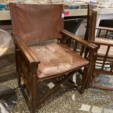Two leather “sling” chairs 25” x 22.5” x 36” seat height 18” Call 202-232-8171 to purchase 