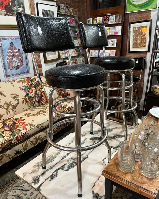 Vintage black vinyl swivel bar stools. 4 available Seat is 15” x 14” 41” to top of back rest seat height 29” Call 202-232-8171 to purchase