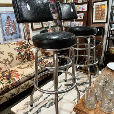 Vintage black vinyl swivel bar stools. 4 available Seat is 15” x 14” 41” to top of back rest seat height 29” Call 202-232-8171 to purchase
