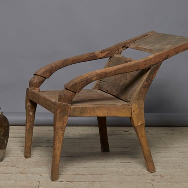 Sculptural Primitive Teak Relaxing Chair from the Island of Sumatra with an Extended Back