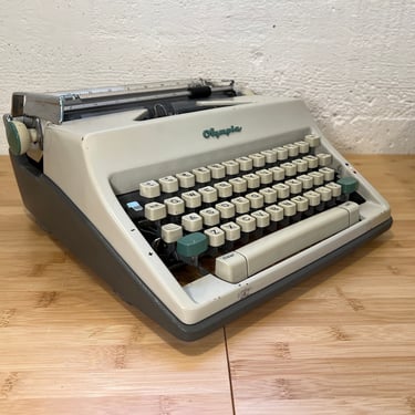 1964 Olympia SM9 Portable Typewriter with Case, New 2-Color Ribbon, Owner's Manual 
