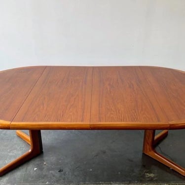 Danish teak round dining table with two leaves by d-scan 