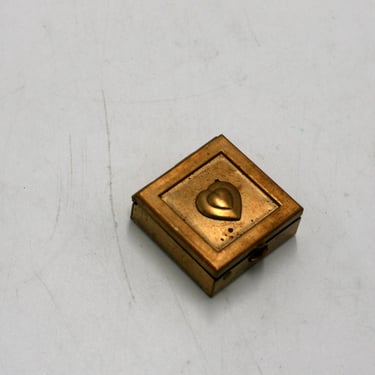 vintage  brass pillbox with embossed heart 