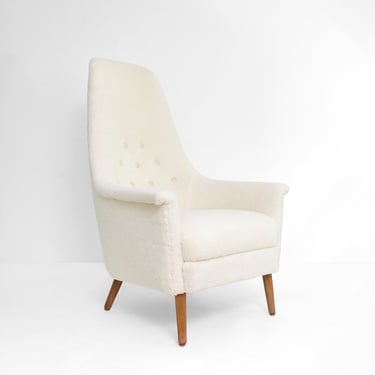 Swedish high back lounge chair in faux sheepskin