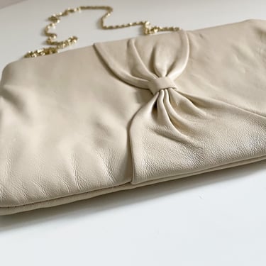 Vintage ‘80s ANDI cream leather clutch with big bow on front | convertible with gold chain shoulder strap 