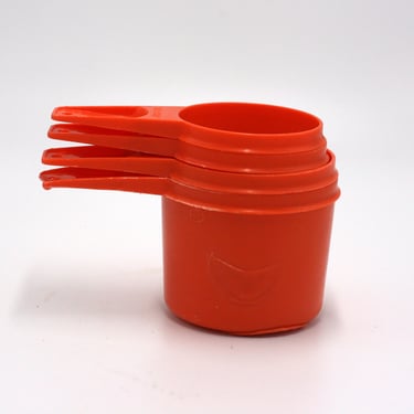 vintage orange tupperware measuring cups 