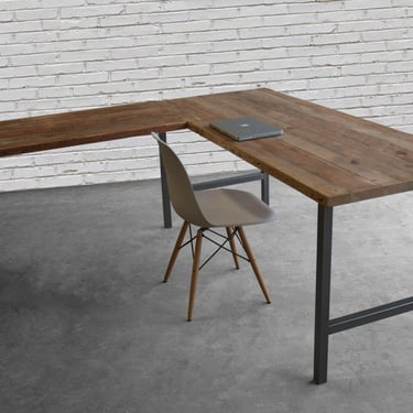 Custom L shape desk created with reclaimed wood and hand welded steel legs 