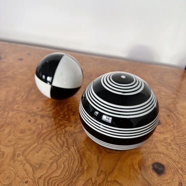 PAIR OF BLACK & WHITE CERAMIC SPHERES