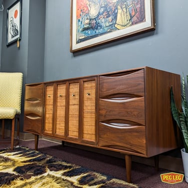 Mid-Century Modern walnut credenza with bifold cane doors