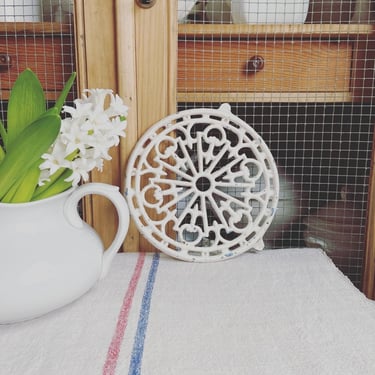 Beautiful vintage French cast iron trivet in a lovely cream 