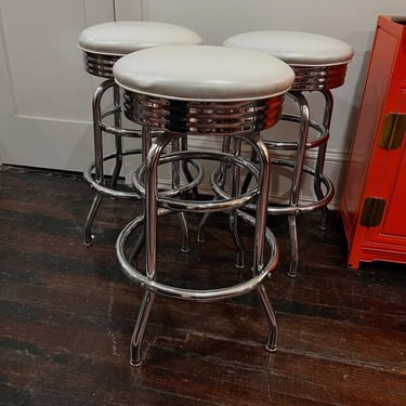 White vinyl top swivel stools. 27” tall top is 15.5” across 