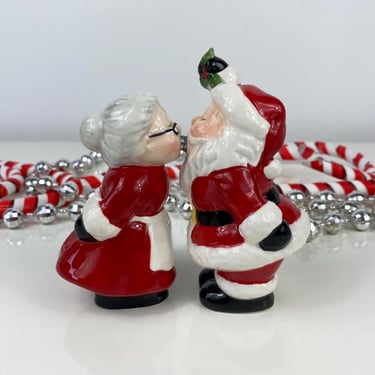 Mr and Mrs Santa Claus stealing a kiss under the mistletoe Salt and Pepper Shaker Set, Santa Magnet Set, Santas Kissing, Mistletoe Kisses 