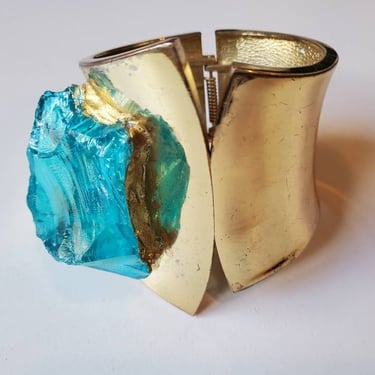 Avant Garde vintage gold tone wide cuff bracelet with teal glass  and sculptured art by Amanda Alarcon-Hunter for Minx and Onyx Vintage 