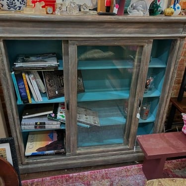 Washed green-gray shelving unit with robins egg blue interior. 49 x 14 x 48” 