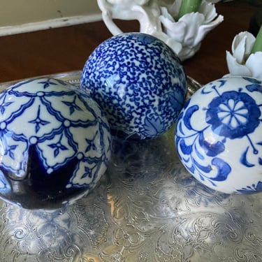 Three Blue and White Carpet Balls 