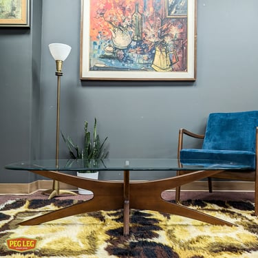 Mid-Century Modern walnut coffee table with glass top in the style of Adrian Pearsall