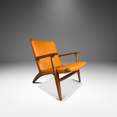 Danish Mid-Century Modern Model CH 25 Lounge Chair in Oak and Leather by Hans J. Wegner for Carl Hansen & Søn, Denmark, c. 1950's 
