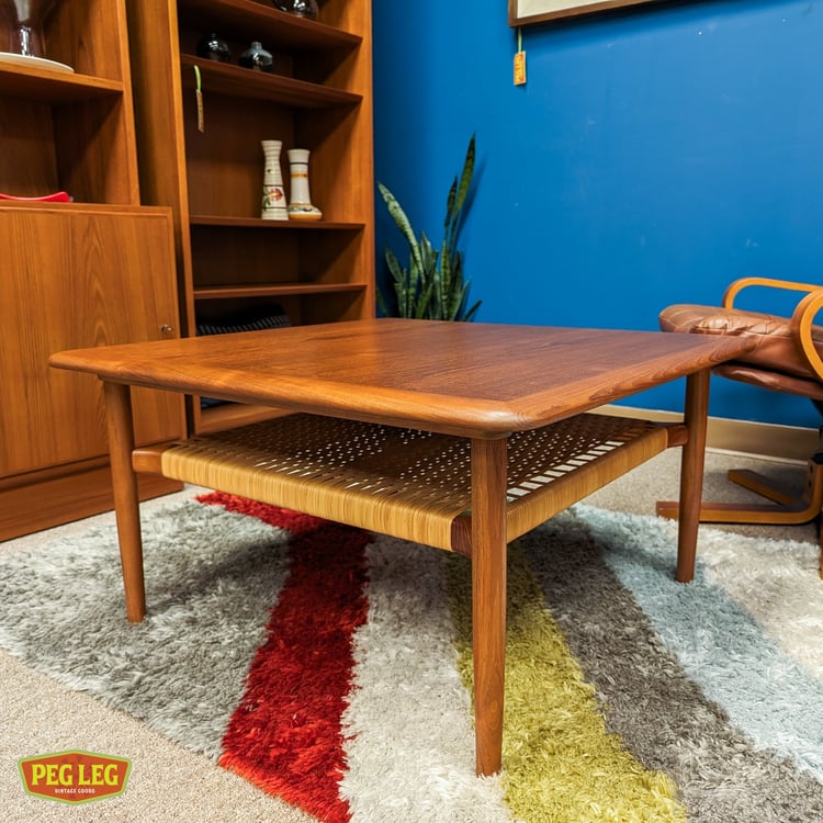 Danish Modern teak coffee table with woven shelf by Kurt Ostervig for Jason Mobler