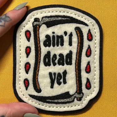 Handmade / hand embroidered off white & black felt patch - Ain’t Dead Yet scythes - vintage style - traditional tattoo flash 
