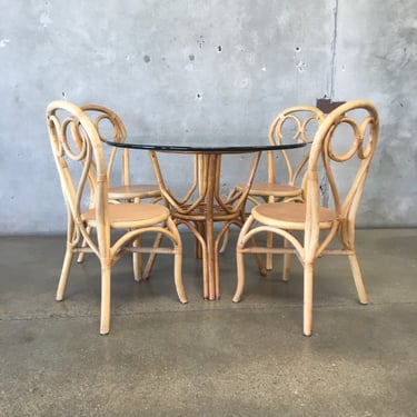 1970's Rattan Dining Set w/ Four Chairs And Glass Topped Table