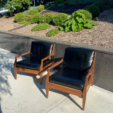 Teak Curved Arm Lounge Chairs with Black Cushions - A Pair