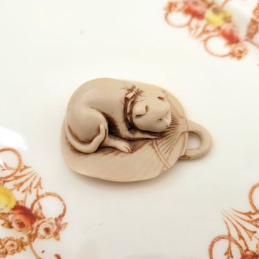 Vintage Japanese Netsuke of a Pet Cat Sleeping on a Fan 