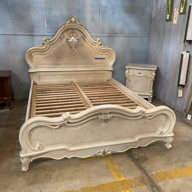 Luxurious Bed Frame with Ornate Headboard and Matching Night Stand