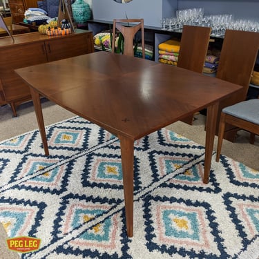 Mid-Century Modern walnut dining table from the Monterey collection by Bassett