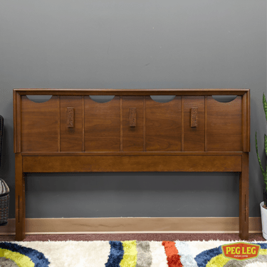 Mid-Century Modern walnut full-size headboard from the Mayan collection by Bassett