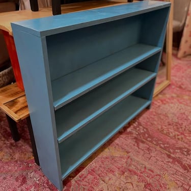 Blue bookshelf. 7.5” deep x 41” wide x 35” tall 