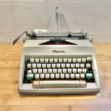 1965 Olympia SM9 Portable Typewriter with Case, New 2-Color Ribbon, Owner's Manual 