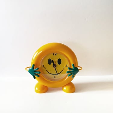 Yellow Smiley Clock with Green Hands 
