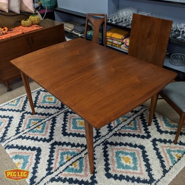 Mid-Century Modern walnut dining table with leaf from the Declaration collection by Drexel