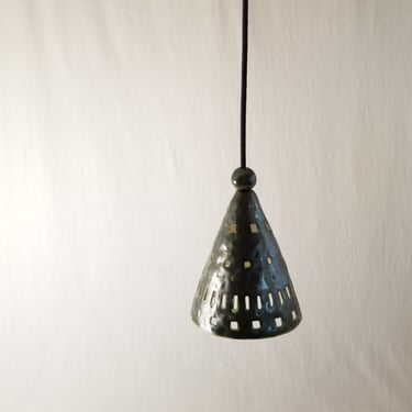 Small cone pendant light with hand cutouts. Glazed in dark green. One-of -a-kind 