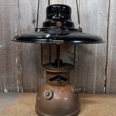 Vintage Petromax-style kerosene lantern with reflector