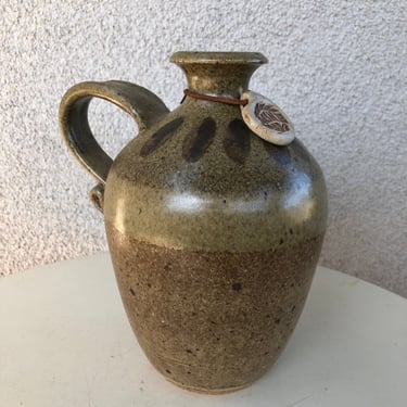 Vintage stoneware pottery wine jug decanter browns signed size 8”x 5-2” 