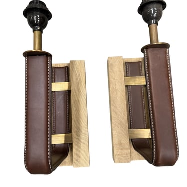 Pair of limited-edition saddle chocolate, brown leather, oak, and bronze sconces