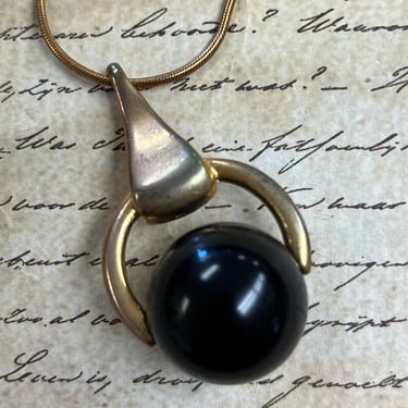 modernist fortune teller necklace 60s black and gold door knocker pendant 