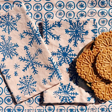 snowflakes on blush. block printed linen napkins / placemats / tea towels. set of four. boho christmas party. holiday decor. winter. 