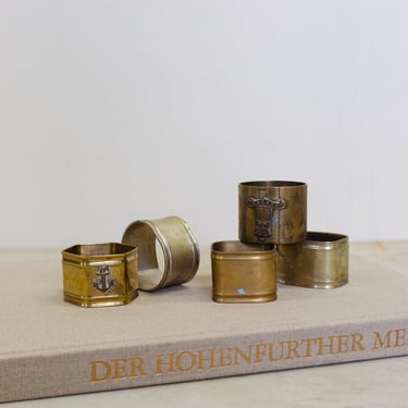 set of 5 assorted brass napkin rings