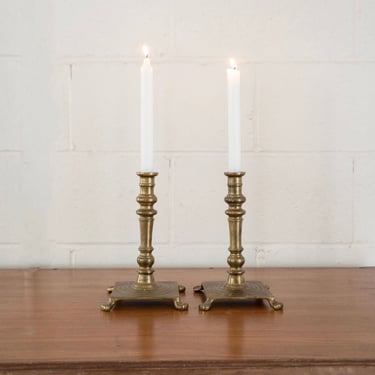 pair of vintage french clawfoot candlesticks