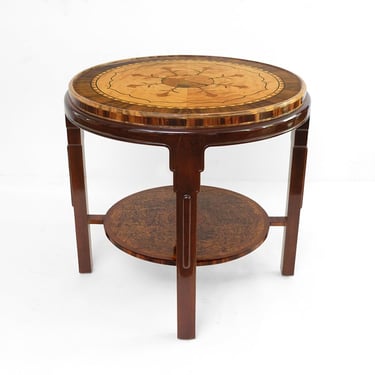 Swedish Grace (1920-30) round marquetry table with reclining woman.